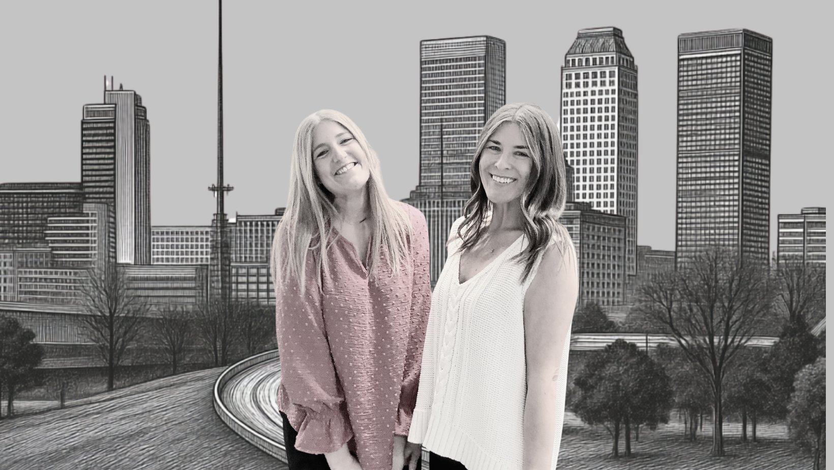 Two smiling women standing together with a cityscape and modern skyscrapers in the background
