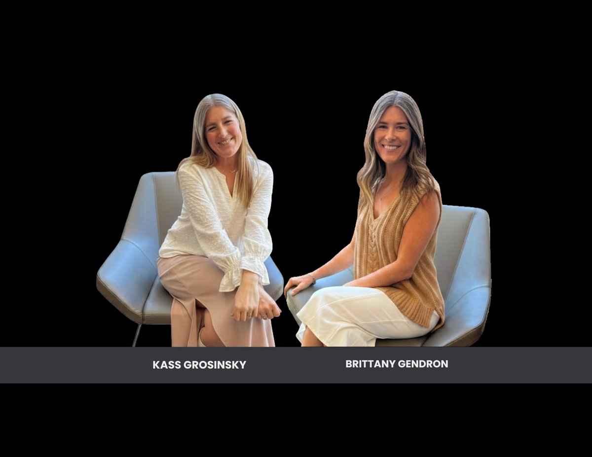 Kass Grosinsky and Brittany Gendron sit facing each other on light blue chairs against a black background